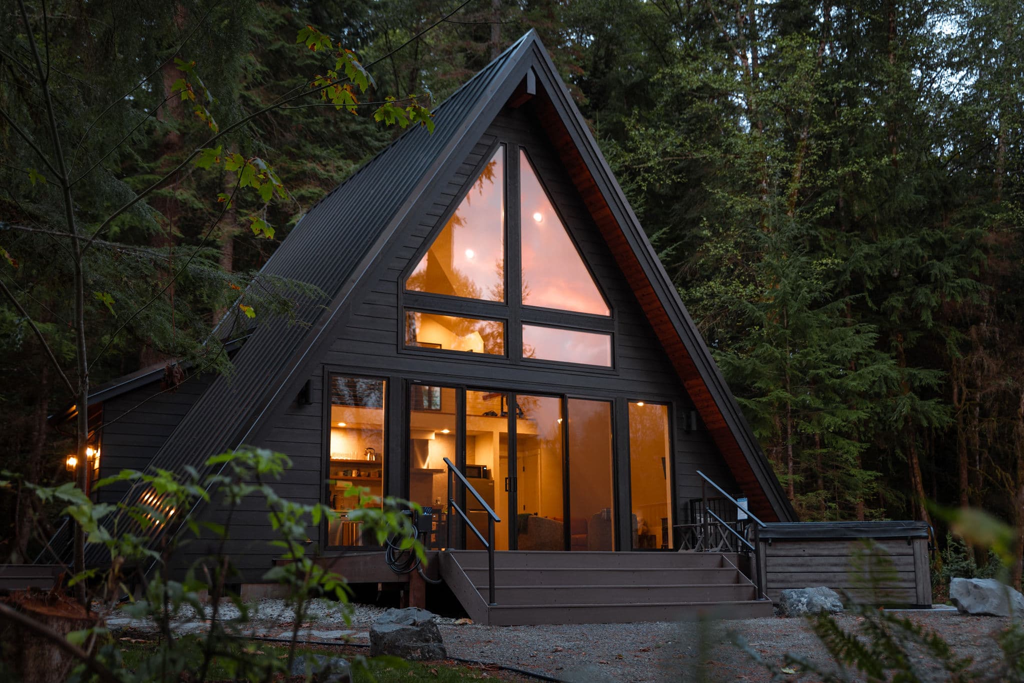 Echo House at dusk, lit from inside