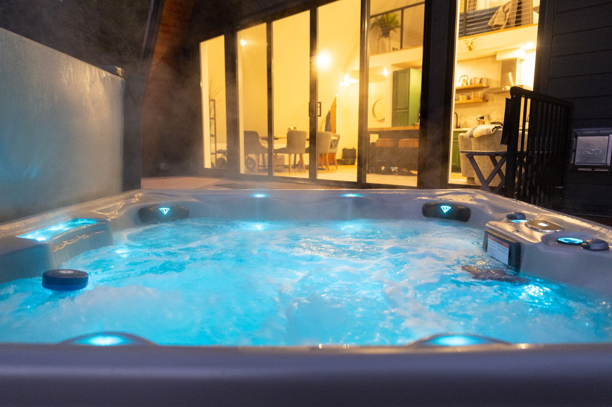 Hot tub lit blue at night