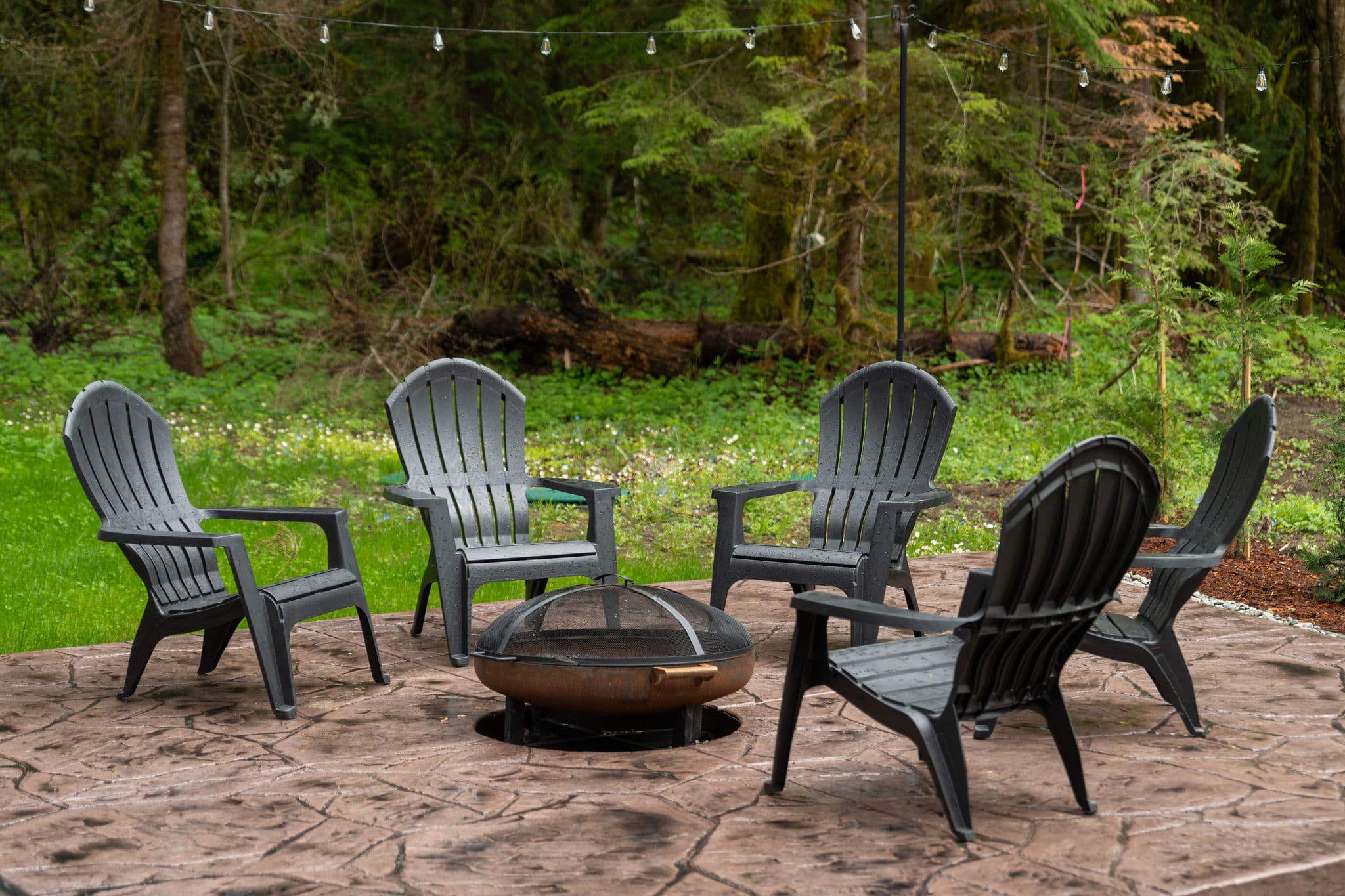 Fire pit patio with Adirondack chairs